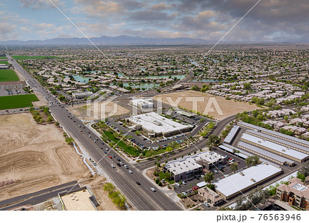 Aerial overlooking desert small town a Avondale city of beautiful highway Arizona on the mountain with traffic line in Interstate expressway near Phoenix AZ US Aerial overlooking desert small town a Avondale city of beautiful highway Arizona on the mountain with traffic line in Interstate expressway near Phoenix AZ US 76563946