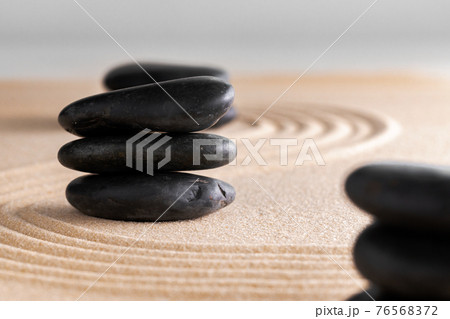 Japanese zen garden with stone in raked sand Japanese zen garden with stone in raked sand 76568372