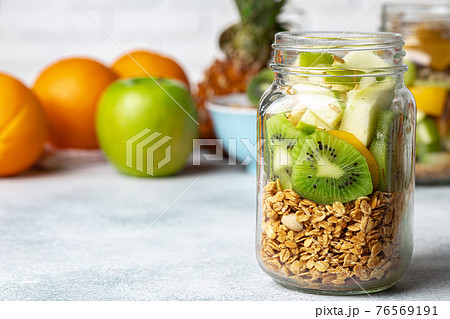 Healthy food: porridge with fruit on the table. Healthy food: porridge with fruit on the table. 76569191