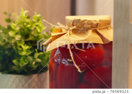 Glass jars with preserved food close up 76569323
