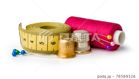 Tailor, needles and threads over white background 76569326