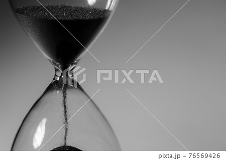 Black and white photo of hourglass close up 76569426