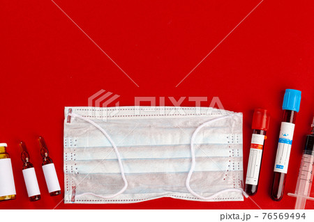 Protective mask with test tubes. Coronavirus outbreak concept 76569494