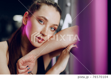 Portrait of a young sporty caucasian woman training in a fitness club 76570104