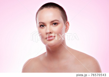 Beauty portrait of a nice young smiling woman with perfect skin Beauty portrait of a nice young smiling woman with perfect skin 76570543