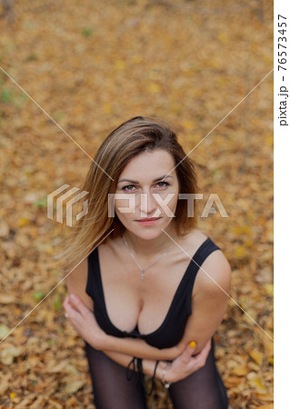 Beautiful woman portrait in forest in autumn. Beautiful woman portrait in forest in autumn. 76573457