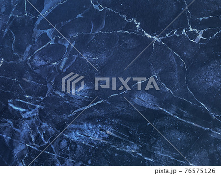 Texture of navy blue marble with lines of pattern, macro background. Dark azure stone backdrop from mineral tile Texture of navy blue marble with lines of pattern, macro background. Dark azure stone backdrop from mineral tile 76575126