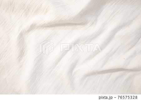 Fabric backdrop White linen canvas crumpled natural cotton fabric Natural handmade linen top view background Organic Eco textiles White Fabric texture 76575328