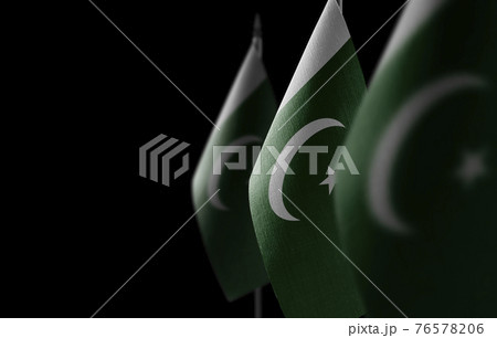Small national flags of the Pakistan on a black background Small national flags of the Pakistan on a black background 76578206