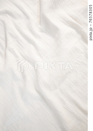 Fabric backdrop White linen canvas crumpled natural cotton fabric Natural handmade linen top view background Organic Eco textiles White Fabric texture 76578305