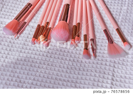 Wet make up brushes on towel, closeup 76578656