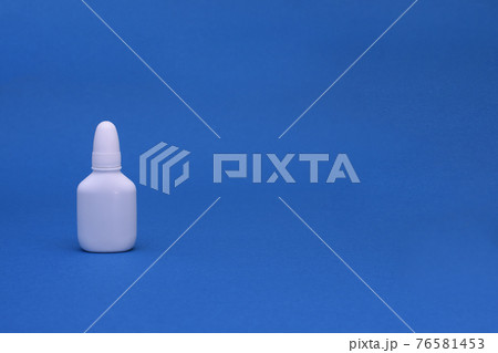 Nasal spray close-up on a blue background. mock up Nasal spray close-up on a blue background. mock up 76581453