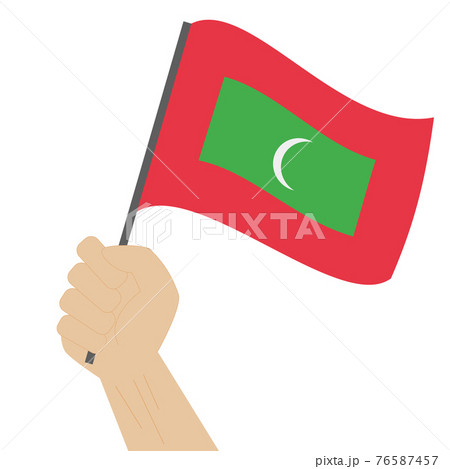 Hand holding and raising the national flag of Maldives Hand holding and raising the national flag of Maldives 76587457