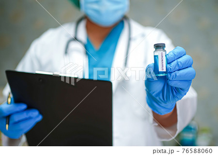 Novel Coronavirus (2019-nCoV) Covid-19 vaccine development medical with syringe for doctor use to treat pneumonia illness patients. Novel Coronavirus (2019-nCoV) Covid-19 vaccine development medical with syringe for doctor use to treat pneumonia illness patients. 76588060