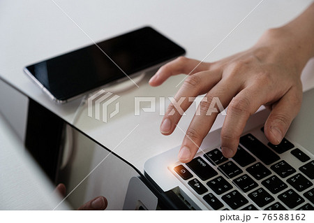 Man press turn off button laptop computer and turn off smartphone Social media disconnect and Technology ban social ban and digital detox concept. Man press turn off button laptop computer and turn off smartphone Social media disconnect and Technology ban social ban and digital detox concept. 76588162