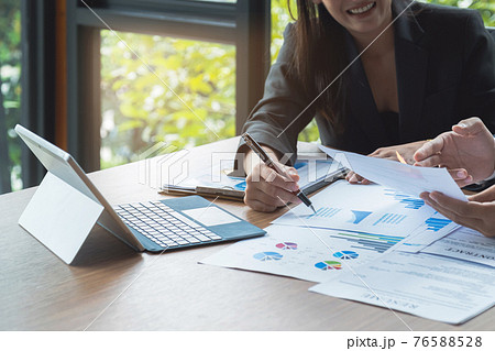 Fund managers team consultation and discuss about analysis Investment stock market by document paper. Fund investment concept. 76588528