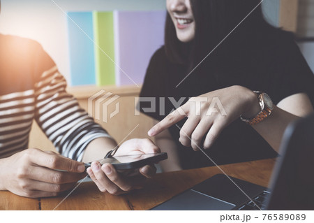 Businesswoman and Businessman using smartphone for compare and share about fund of financial while work from home. 76589089