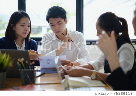 Business team discussing togethe during meeting at office. Colleagues workshopping business ideas. Brainstorm and ideas Concept. 76589118