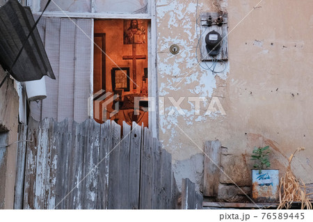 Yerevan, Armenia, Alexander Kirillov - 30082019: Cond, open window and religious symbols in the room 76589445
