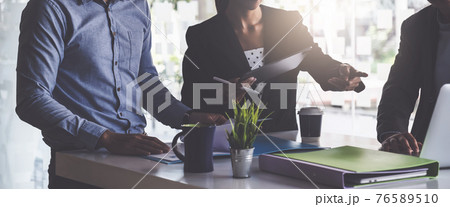 Group of Businessman and Accountant checking data document on digital tablet for investigation of corruption account . Anti Bribery concept. Group of Businessman and Accountant checking data document on digital tablet for investigation of corruption account . Anti Bribery concept. 76589510