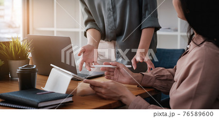 Fund managers team consultation and discuss about analysis Investment stock market by digital tablet. 76589600