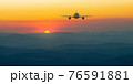 Passenger airliner fly on beauty sunrise or sunset mountain landscape 76591881