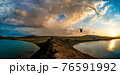 paraglider pilot fly in sky on beauty nature mountain and sea landscape 76591992