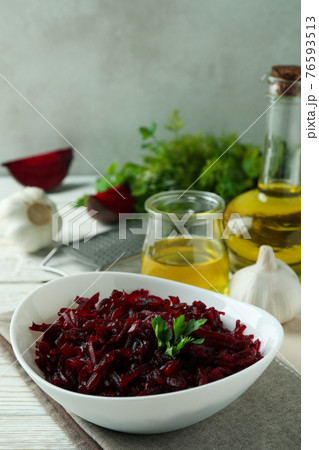 Concept of tasty eating with beet salad on white wooden background 76593513