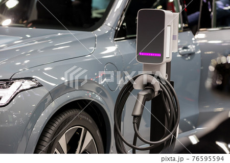 Electric car charging station. Hybrid car Electric charger station in the Car Park. Electric car charging station. Hybrid car Electric charger station in the Car Park. 76595594