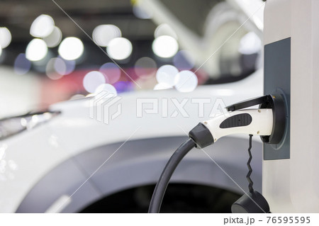 Electric car charging station. Hybrid car Electric charger station in the Car Park. Electric car charging station. Hybrid car Electric charger station in the Car Park. 76595595