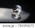 Excellent diamond of the first water with reflection on black mirror background close up view. Jewelry diamonds sale, invitation, action, discount banner, poster, card template with copy space 76595675