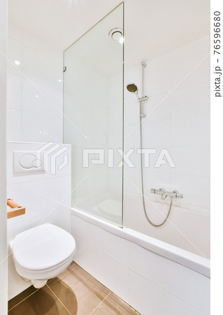 Interior of modern light bathroom with toilet 76596680