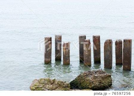Destroyed beach house in aftermath of hurricane and flood 76597256