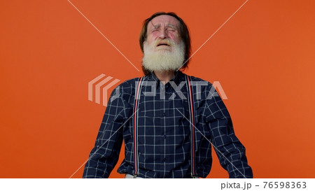 Frustrated elderly bearded man screams from stress tension problems feels horror hopelessness fear Frustrated elderly bearded man screams from stress tension problems feels horror hopelessness fear 76598363