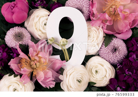 Colorful flowers, leaves and number nine 76599333