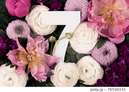 Colorful flowers, leaves and number seven 76599335