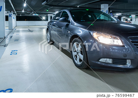 Parking car. Empty road asphalt background. Car lot parking space in underground city garage. Interior underground carpark. 76599467