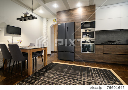 Modern luxurious dark brown, gray and black kitchen details Modern luxurious dark brown, gray and black kitchen details 76601645