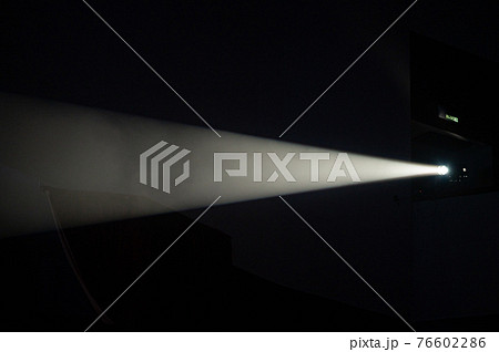 Multi-color light on dark stage in fog 76602286