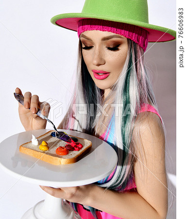 Portrait of young woman modern artist in pink 76606983