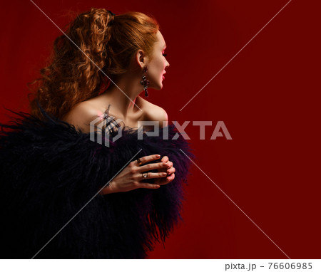 Gorgeous rich young woman with red curly hair 76606985