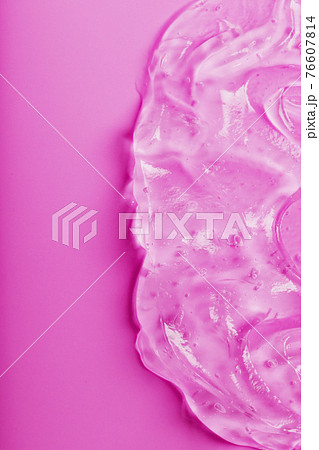 Transparent liquid gel on a pink background with free space. Transparent liquid gel on a pink background with free space. 76607814