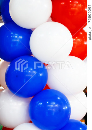 Helium air festive multicolored bright balloons blue red white colors of the Russian flag 76609092