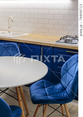 Beautiful white round table in the kitchen Beautiful white round table in the kitchen 76609713