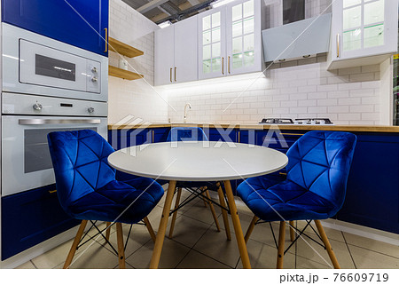 Beautiful white round table in the kitchen 76609719