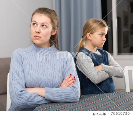 Woman and daughter offended at each other 76610730
