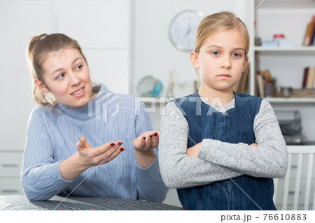 Offended girl turned away Offended girl turned away 76610883