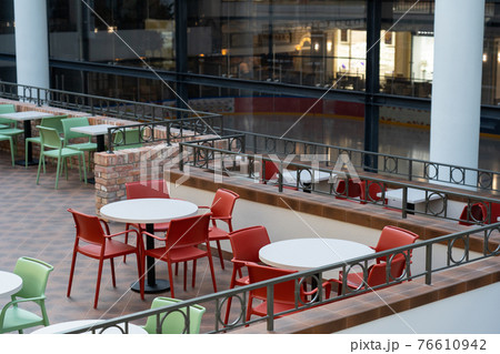 Interior of wooden table in food court shopping mall. Interior of wooden table in food court shopping mall. 76610942