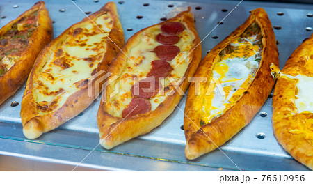 Assorted Turkish foodset. Pide with mea pide with cheese, pide mix 76610956