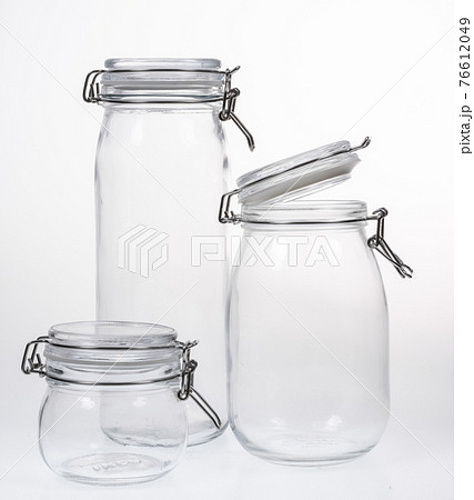 Collection of empty jars on white background with clipping pat 76612049
